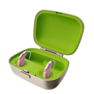 Cargador Phonak Charger Combi BTE 2 con audífonos Naída o Sky L-PR en color rosa en proceso de carga - Pilas Audífono